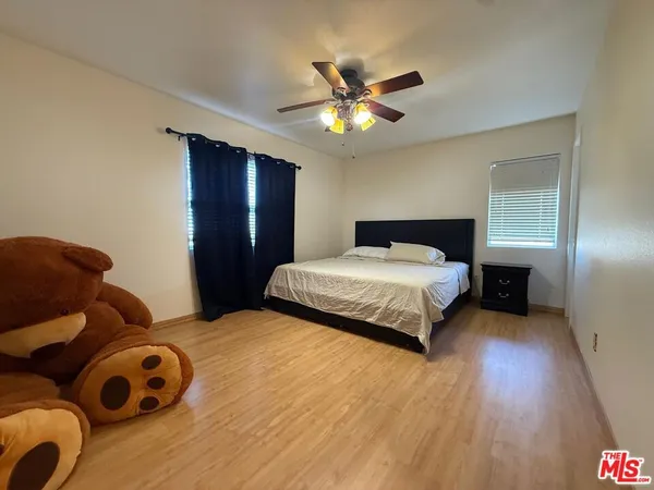 a bedroom with a bed and closet