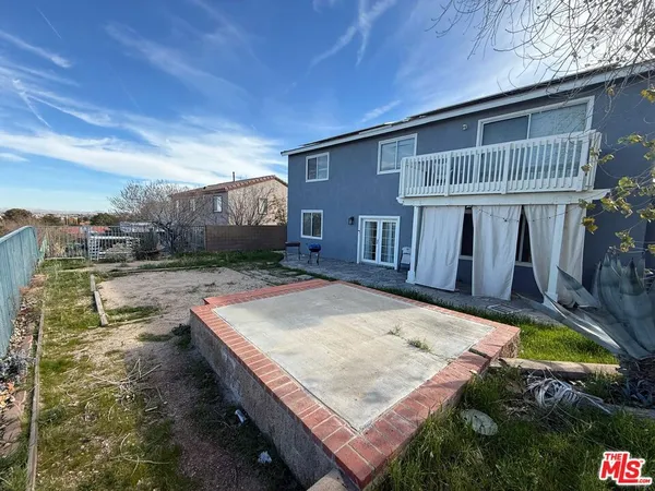 a view of a roof deck with wooden floor
