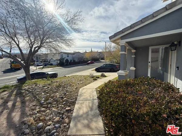 a bed sitting in front of a house