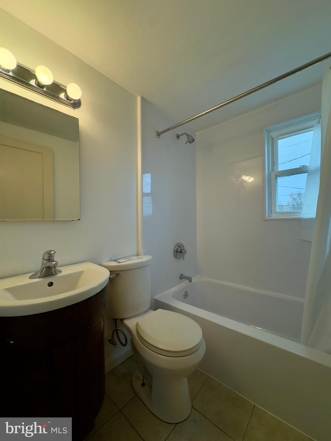 116 Carver Road Dundalk, MD 21222 - Photo 12 of 19 a bathroom with a sink a toilet and shower
