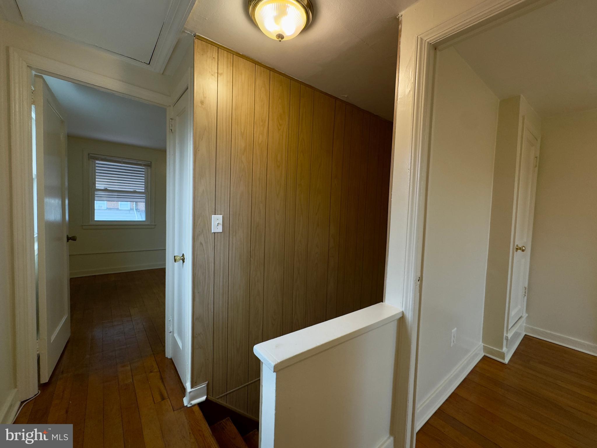 116 Carver Road Dundalk, MD 21222 - Photo 13 of 19 a view of a hallway with wooden floor