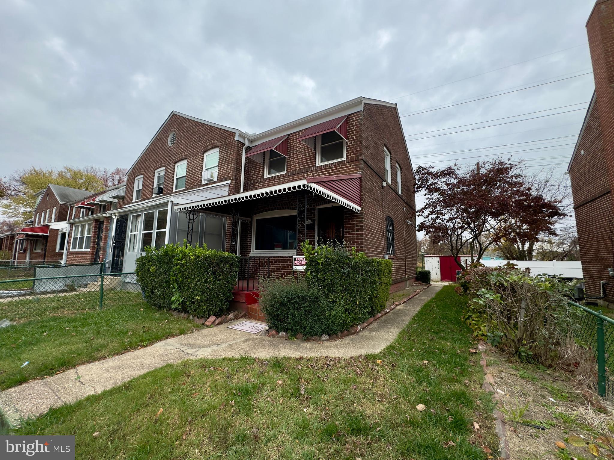 116 Carver Road Dundalk, MD 21222 - Photo 2 of 19 a front view of a house with a yard and trees