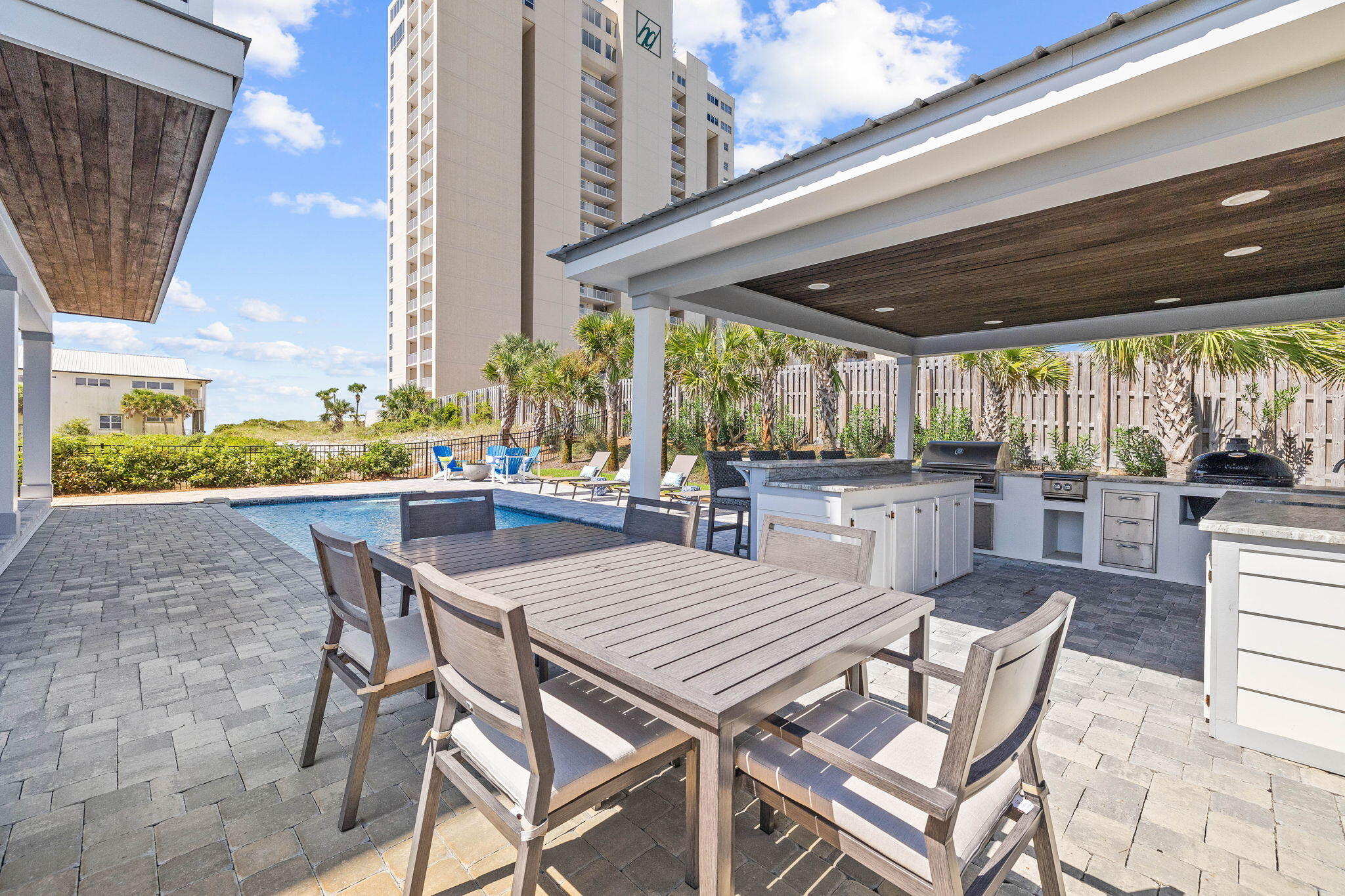 102 Overlook Circle Miramar Beach, FL 32550 - Photo 12 of 38 a view of a patio with a table and chairs and potted plants
