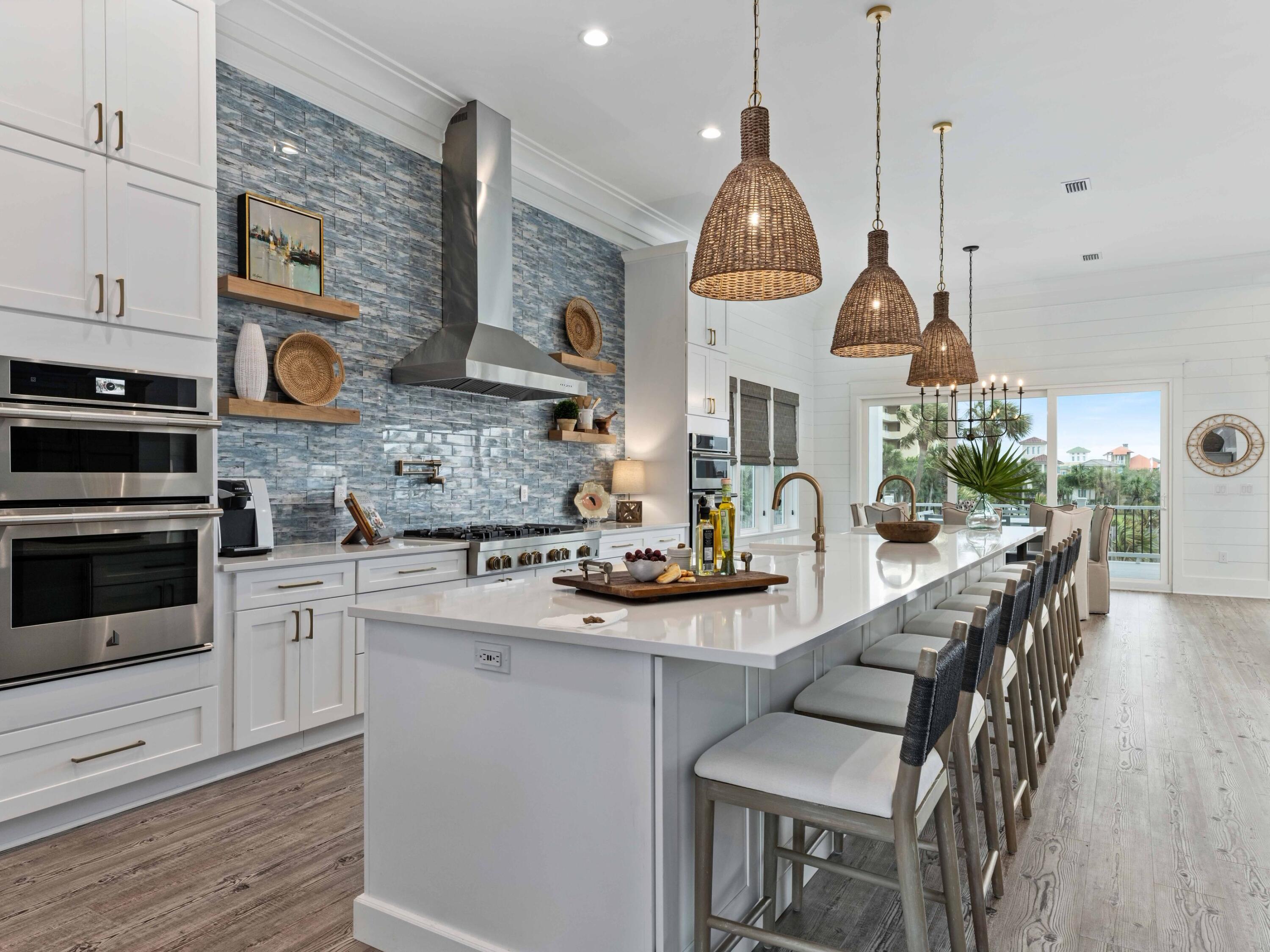 102 Overlook Circle Miramar Beach, FL 32550 - Photo 2 of 38 a kitchen with granite countertop a stove a sink a dining table and chairs