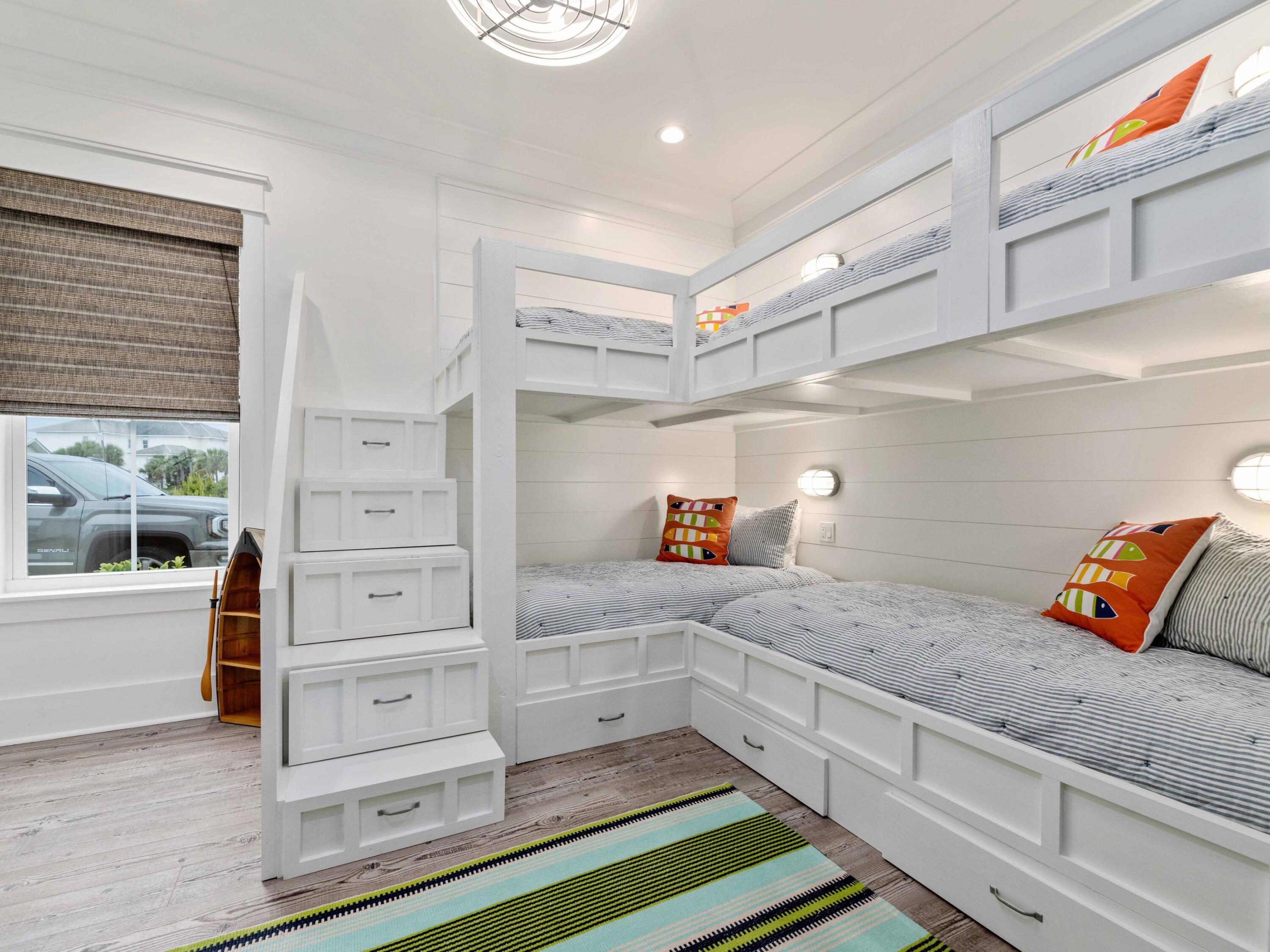 102 Overlook Circle Miramar Beach, FL 32550 - Photo 22 of 38 a kitchen with granite countertop white cabinets and wooden floor