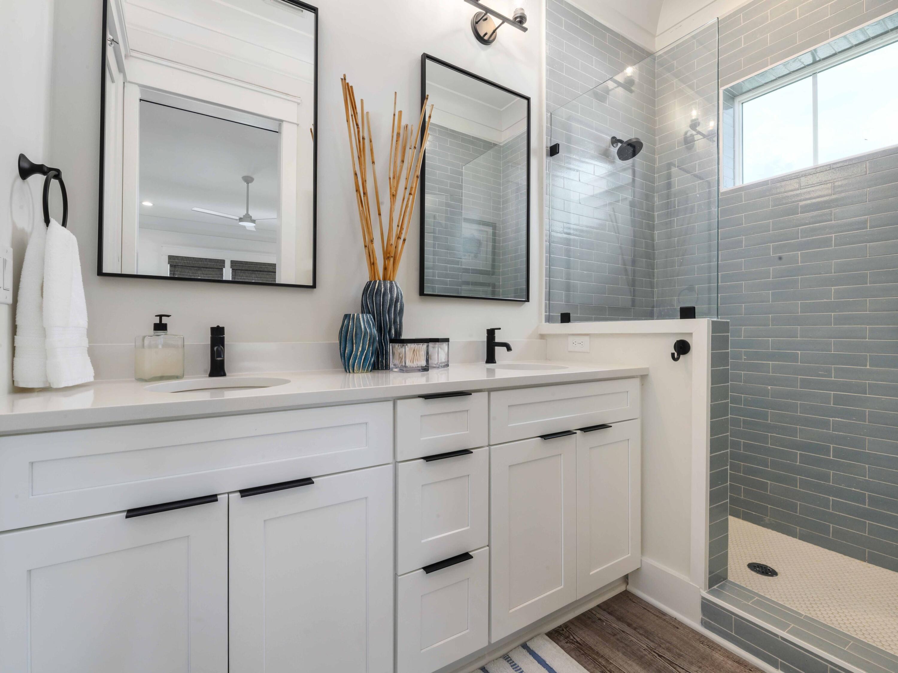 102 Overlook Circle Miramar Beach, FL 32550 - Photo 24 of 38 a bathroom with a double vanity sink mirror and shower