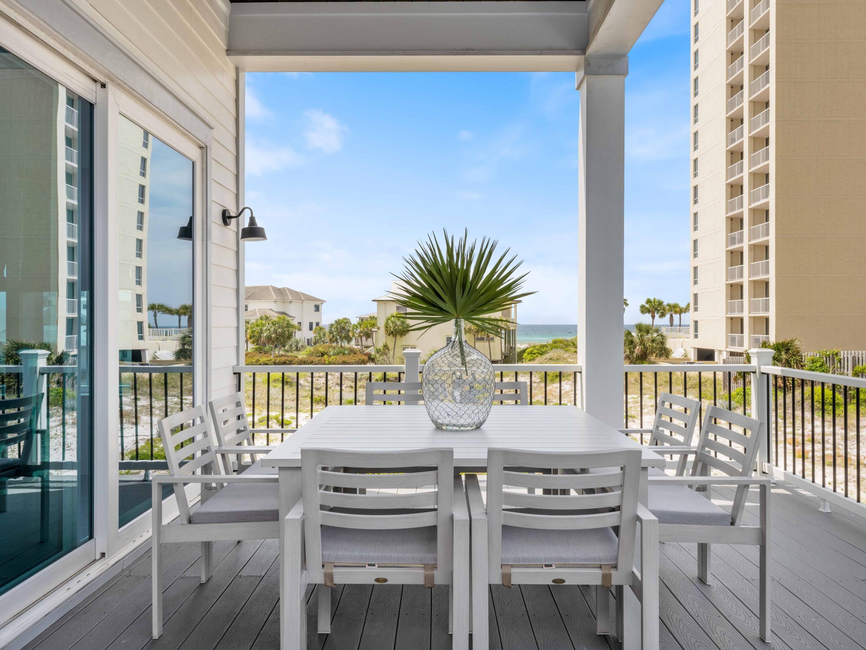 102 Overlook Circle Miramar Beach, FL 32550 - Photo 5 of 38 a view of a balcony with furniture and floor to ceiling window