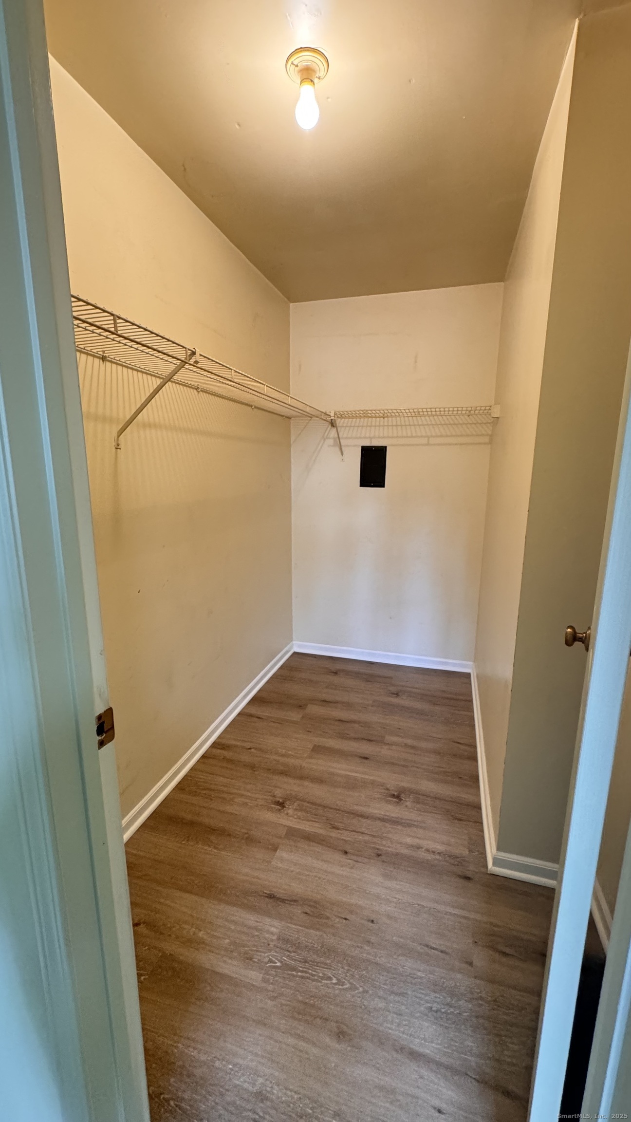 25 Janet Circle, Unit F Bridgeport, CT 06606 - Photo 13 of 22 a view of empty room with wooden floor