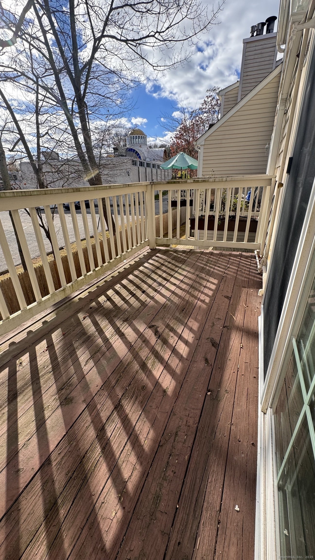 25 Janet Circle, Unit F Bridgeport, CT 06606 - Photo 22 of 22 a view of balcony with wooden floor and fence and floor