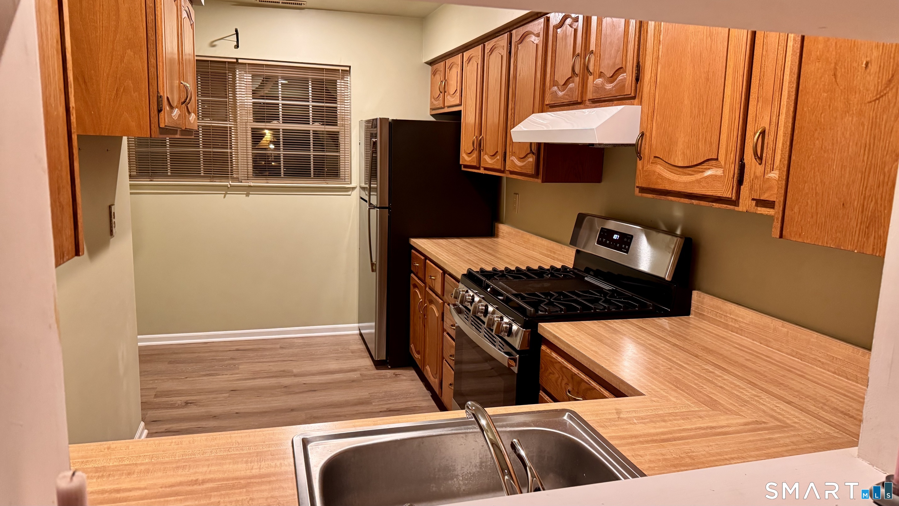 25 Janet Circle, Unit F Bridgeport, CT 06606 - Photo 7 of 23 a view of kitchen and utility room