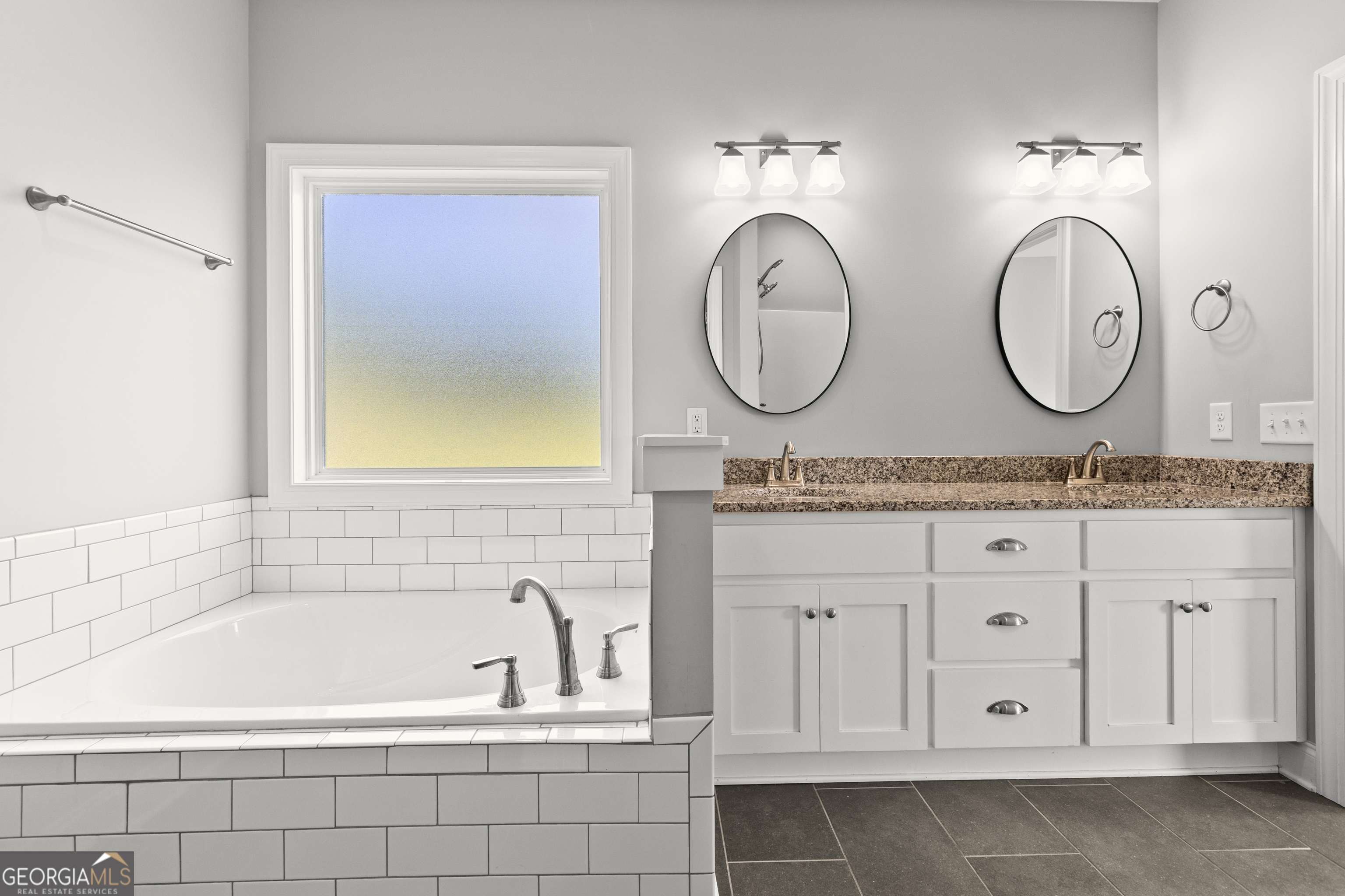 1641 County Road Lanett, AL 36863 - Photo 12 of 32 Primary bathroom double vanity with granite countertops and soaking tub.
