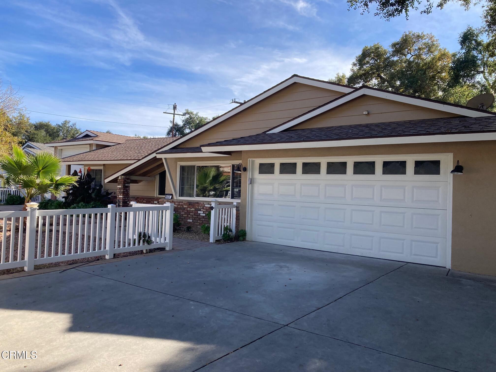 866 Cambon Circle Ojai, CA 93023 - Photo 2 of 27 a view of a house with wooden fence