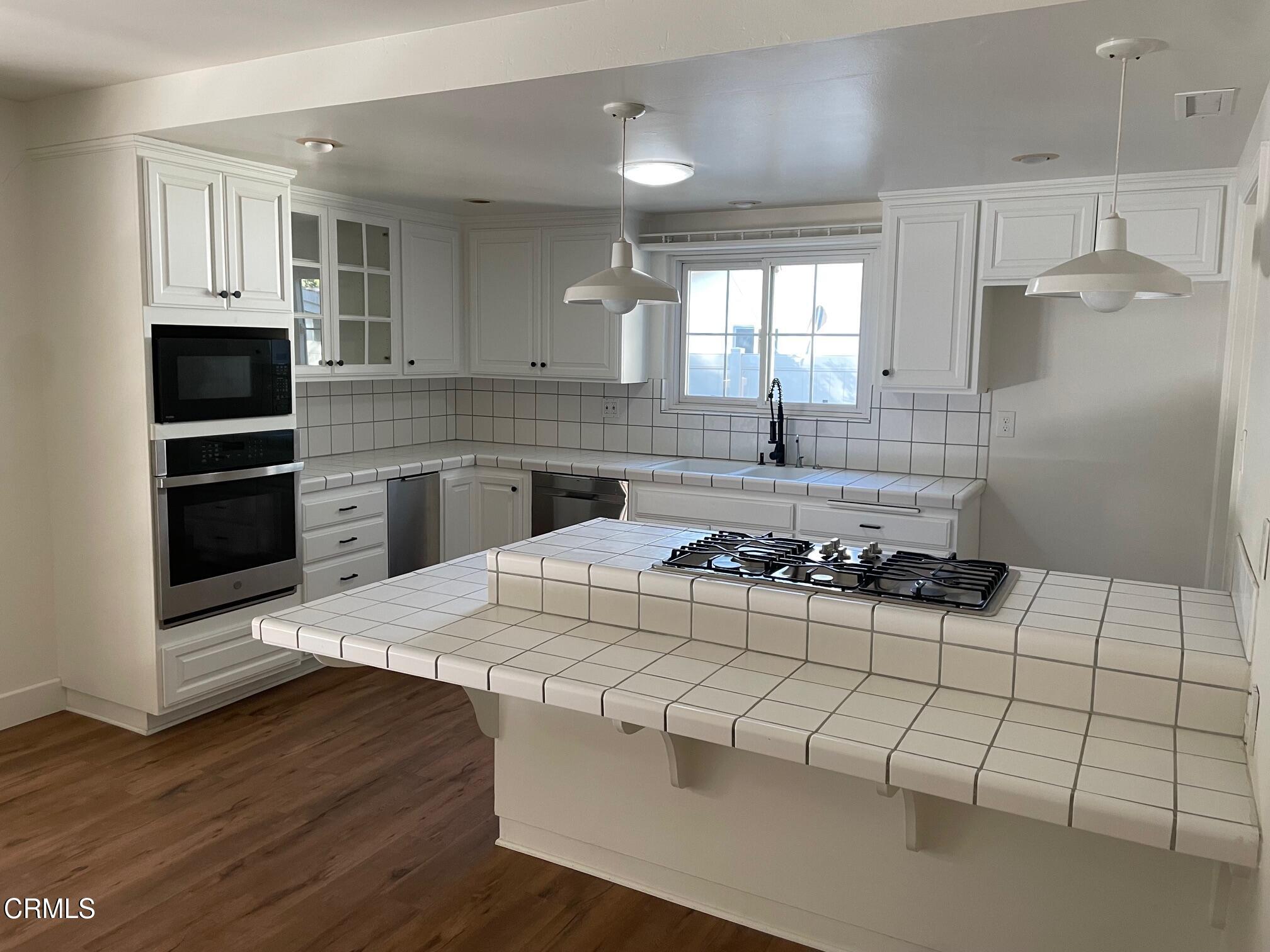 866 Cambon Circle Ojai, CA 93023 - Photo 6 of 27 a kitchen with a sink a stove and refrigerator