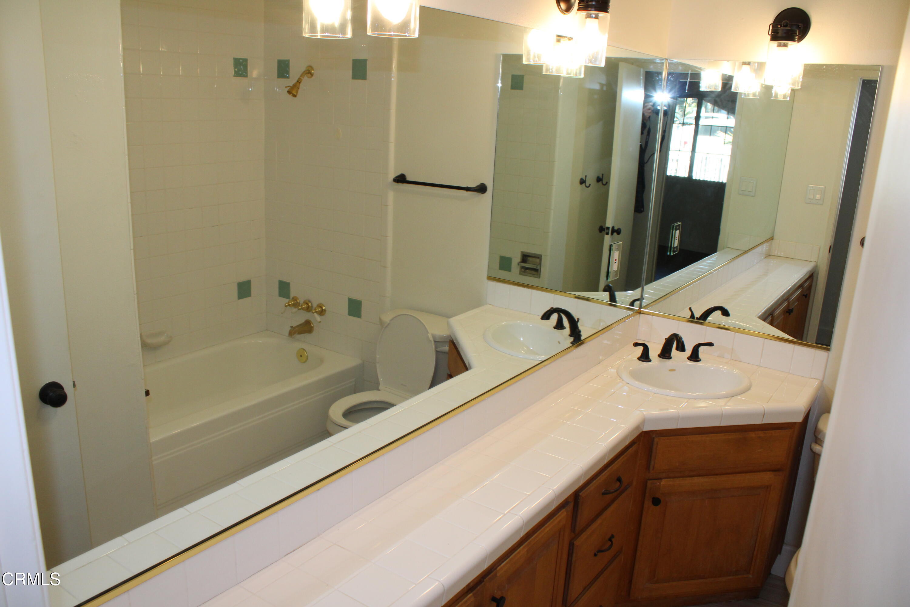 866 Cambon Circle Ojai, CA 93023 - Photo 10 of 27 a bathroom with a tub sink and mirror