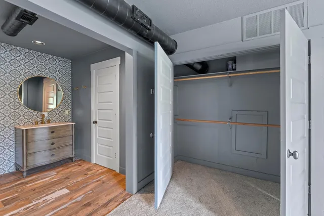 a room with closet and mirror