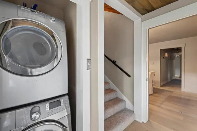 a view of a hallway with washer and dryer