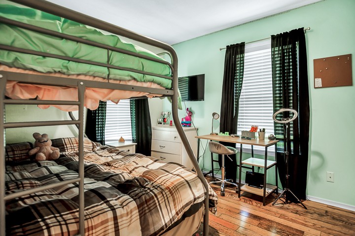 148 Thomas Road Livingston, TN 38570 - Photo 20 of 38 a bed sitting in a bedroom next to a window