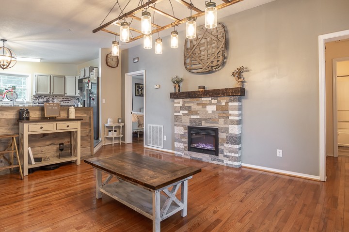 148 Thomas Road Livingston, TN 38570 - Photo 4 of 38 an open kitchen with a table and a fireplace