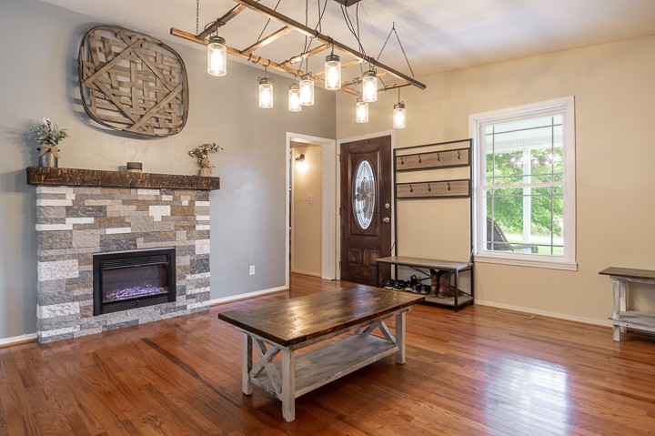 148 Thomas Road Livingston, TN 38570 - Photo 6 of 38 a living room with furniture a table and a fireplace