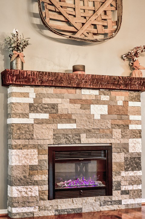 148 Thomas Road Livingston, TN 38570 - Photo 7 of 38 a fireplace with a vase and a chandelier
