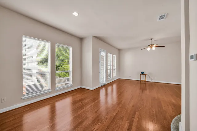 a kitchen with stainless steel appliances granite countertop a refrigerator stove top oven and sink