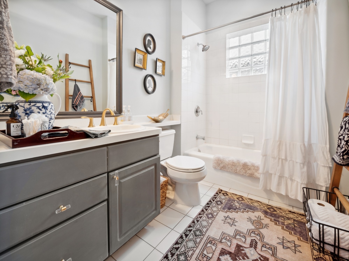 1827 West Addison Street, Unit 2 Chicago, IL 60613 - Photo 16 of 18 a bathroom with a toilet sink and mirror