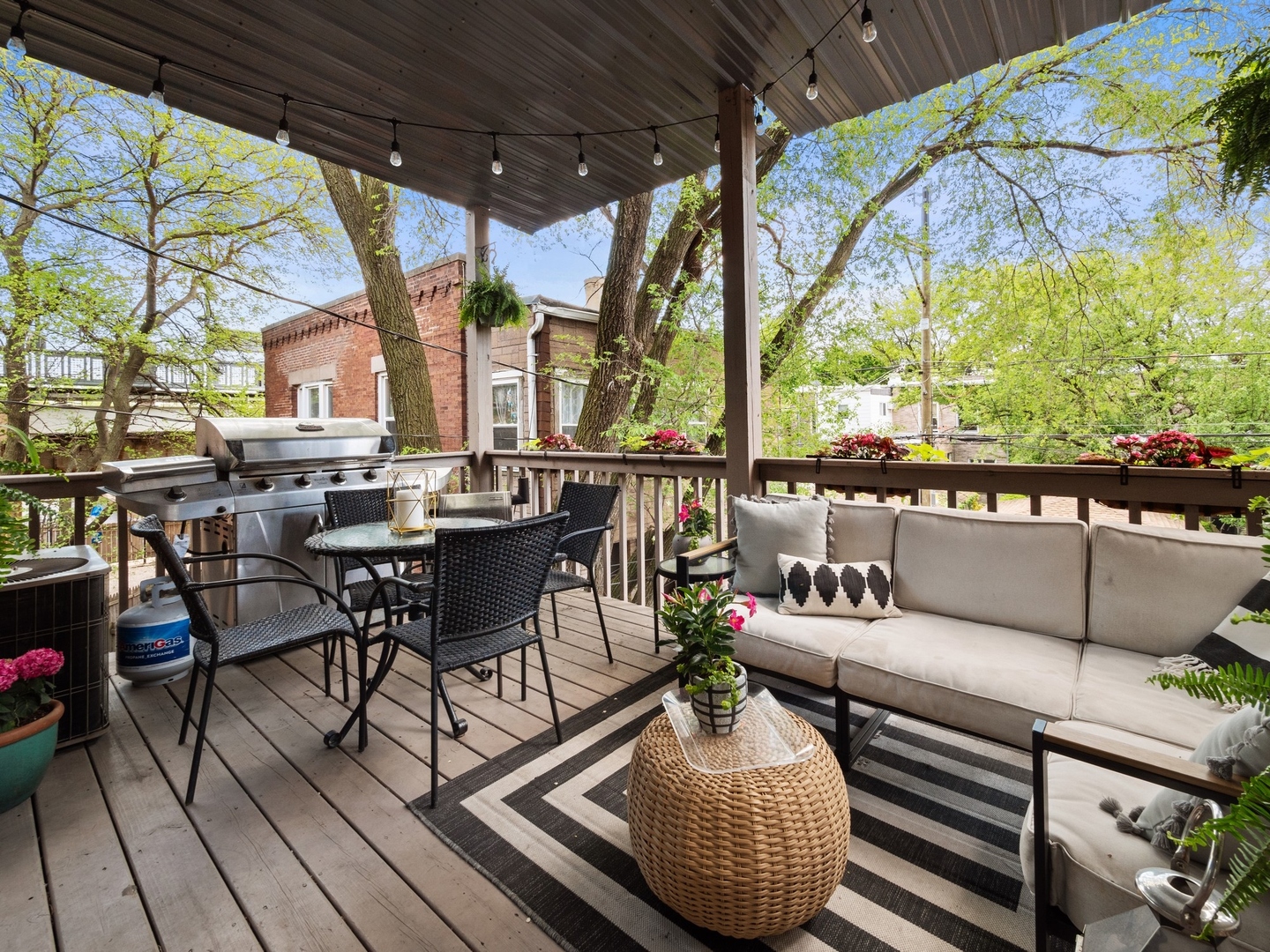 1827 West Addison Street, Unit 2 Chicago, IL 60613 - Photo 17 of 18 a outdoor living space with patio furniture and wooden floor
