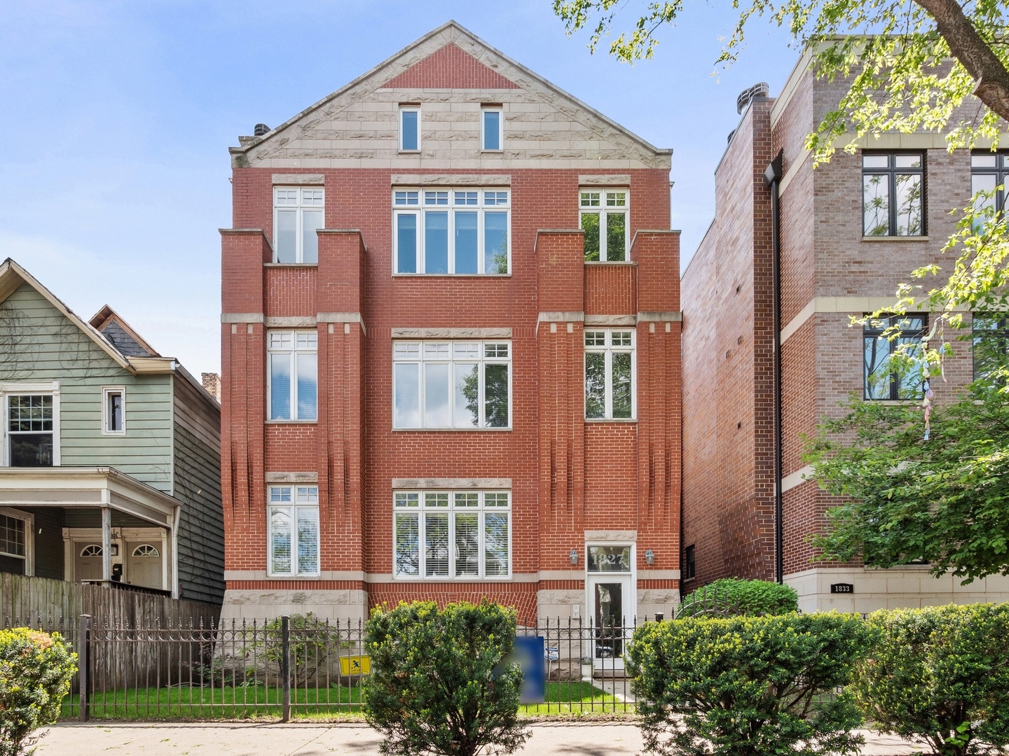 1827 West Addison Street, Unit 2 Chicago, IL 60613 - Photo 18 of 18 front view of a brick house with a yard