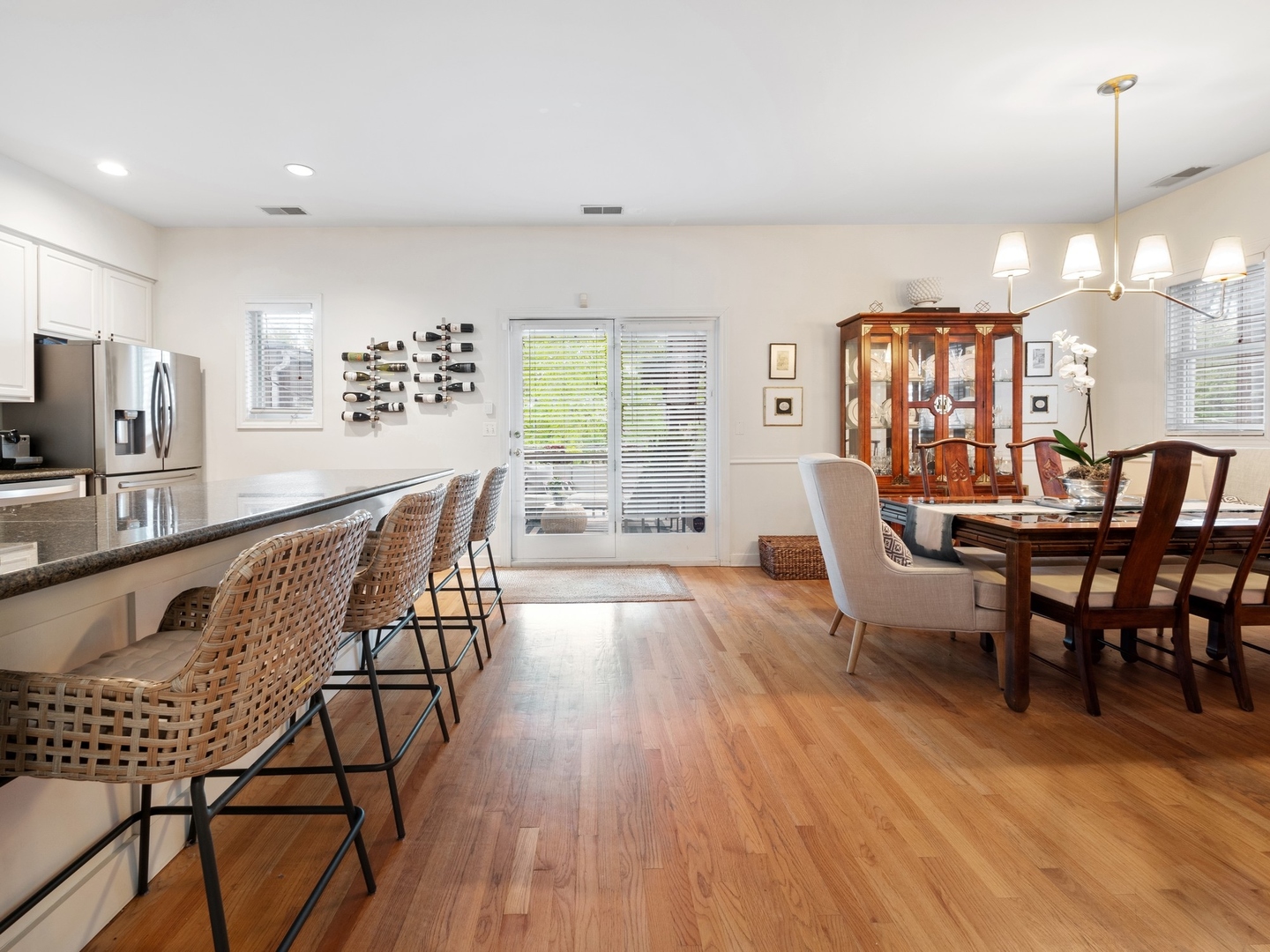 1827 West Addison Street, Unit 2 Chicago, IL 60613 - Photo 6 of 18 a dining room with furniture a chandelier and wooden floor