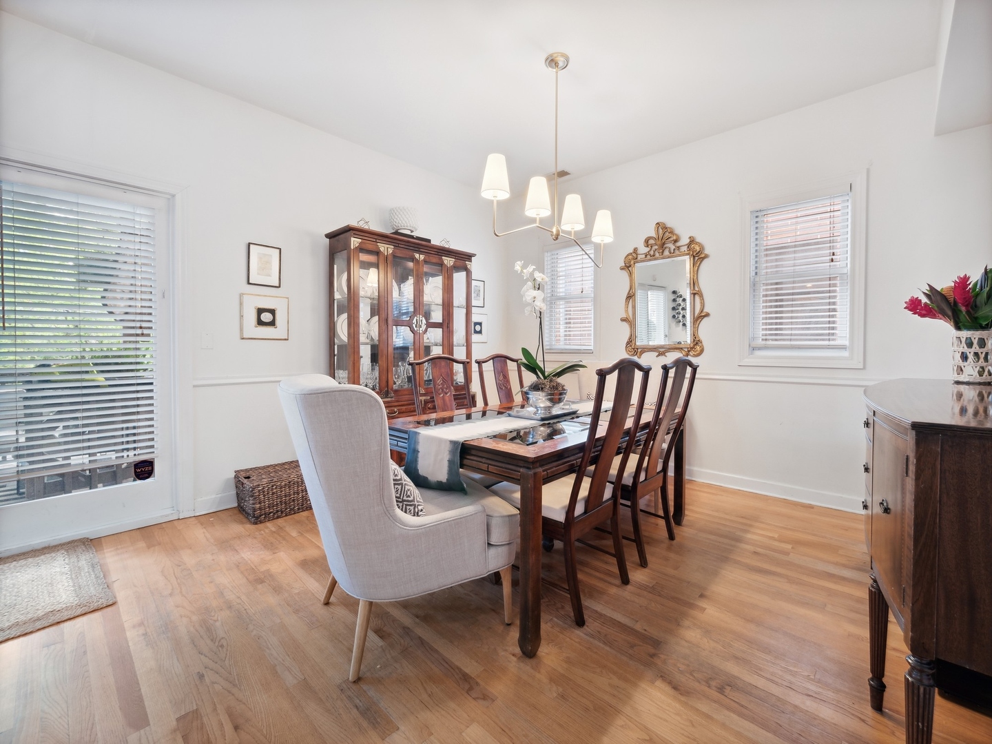 1827 West Addison Street, Unit 2 Chicago, IL 60613 - Photo 7 of 18 a view of a dining room with furniture window and wooden floor