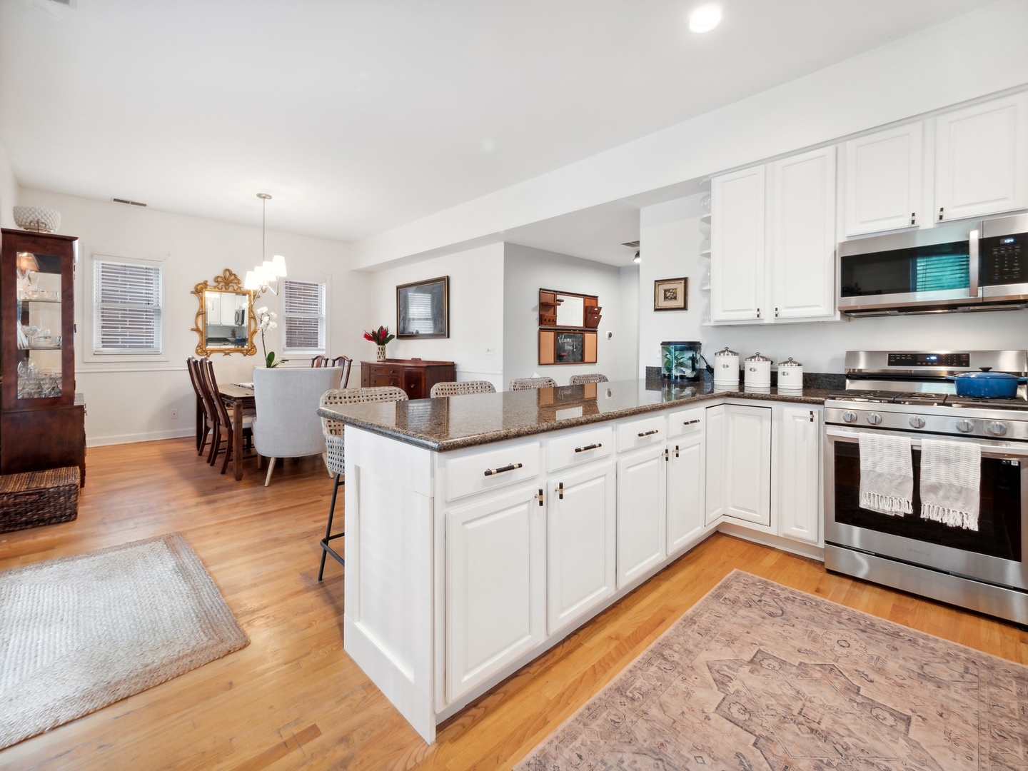 1827 West Addison Street, Unit 2 Chicago, IL 60613 - Photo 10 of 18 a kitchen with a sink stove and cabinets