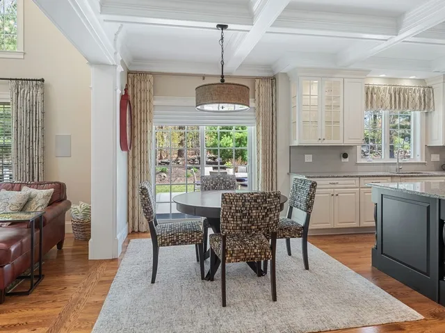 a dining room with furniture window wooden floor