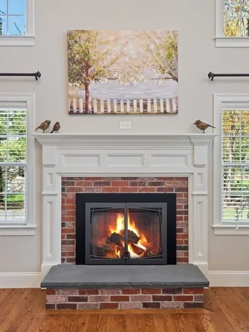 a fireplace with a clock on top of it