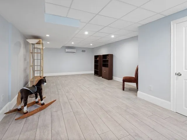a view of room with furniture and floor to ceiling window