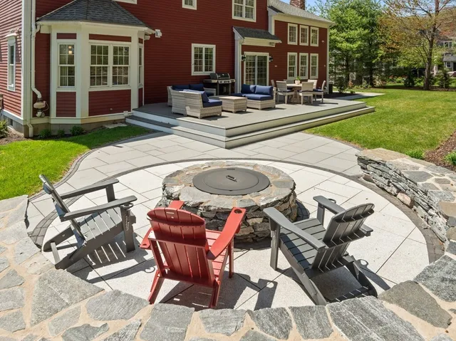 a dinning table and chairs in the garden
