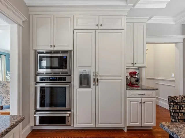 a kitchen with appliances and cabinets