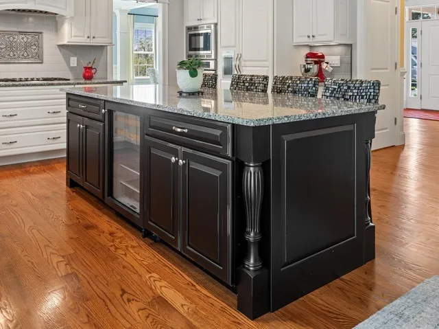 a kitchen with stainless steel appliances granite countertop a sink and cabinets