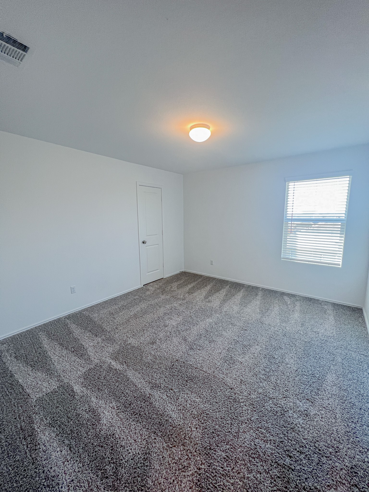 438 Perfect World Loop Jarrell, TX 76537 - Photo 30 of 35 a view of an empty room and a window