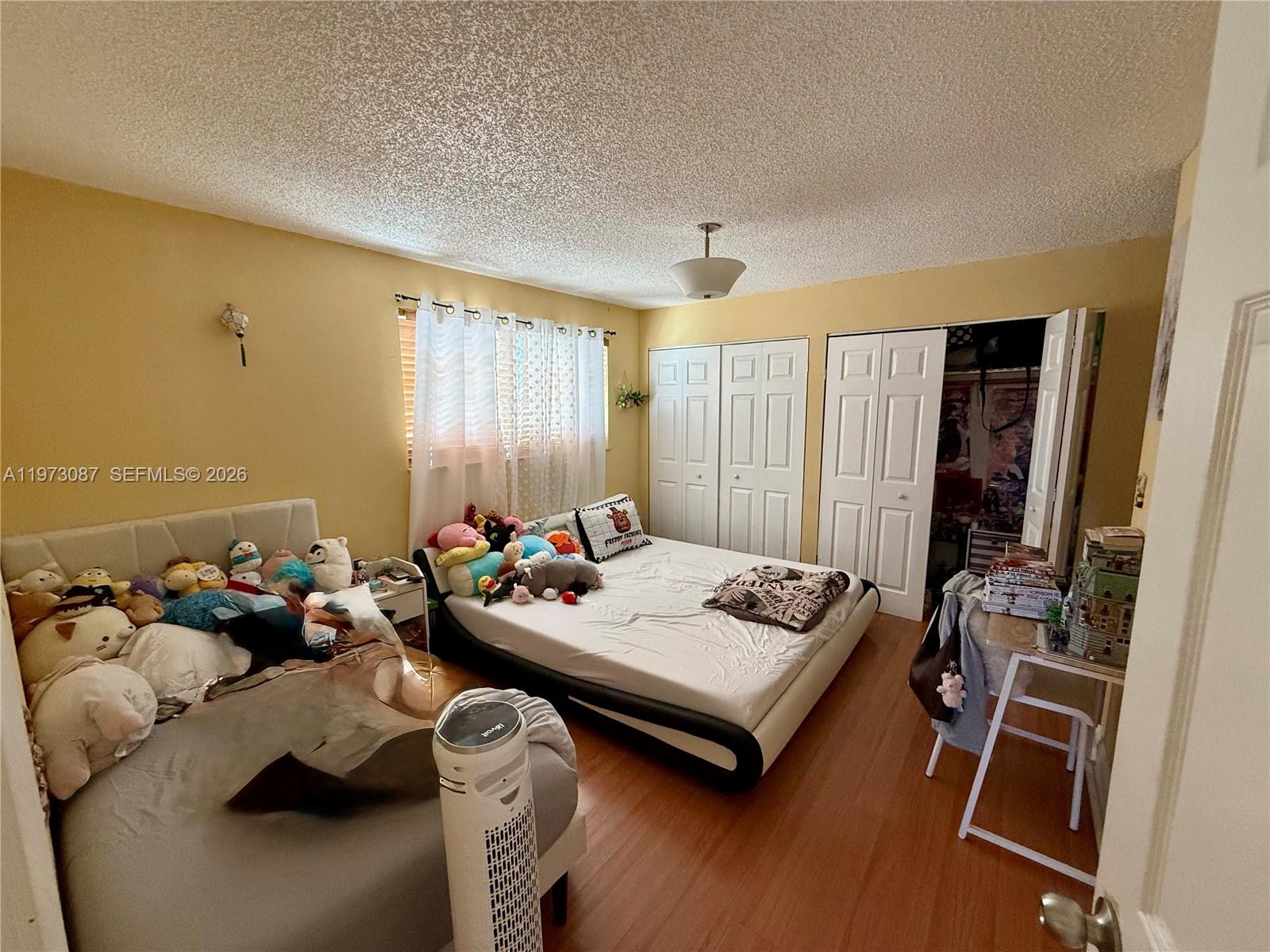 1236 Alton Road, Unit 401 Miami Beach, FL 33139 - Photo 12 of 14 a view of a workspace with furniture and a window