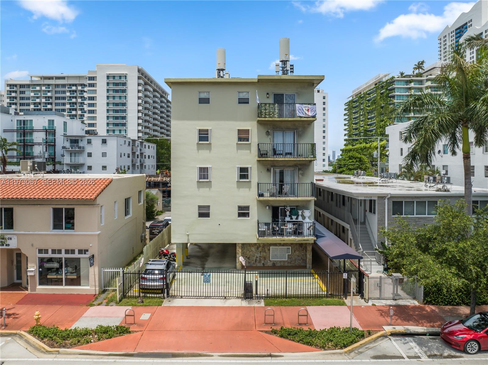 1236 Alton Road, Unit 401 Miami Beach, FL 33139 - Photo 2 of 14 a front view of a multi story building