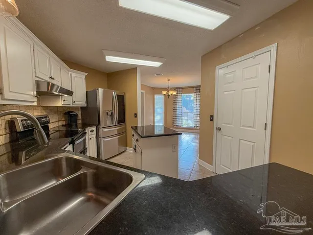 a view of livingroom with hardwood floor and a ceiling fan
