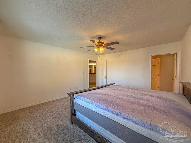 a bathroom with a granite countertop sink and a mirror a bathtub
