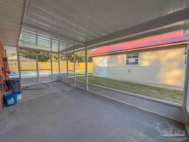a view of a swimming pool with a patio