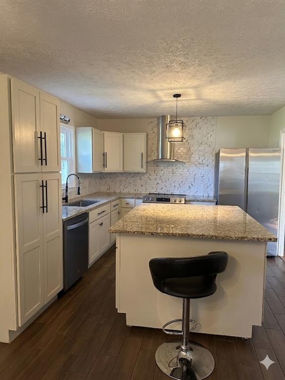 27 Carriage Trace Southeast Cartersville, GA 30121 - Photo 10 of 26 a kitchen with kitchen island stainless steel appliances a sink cabinets and wooden floor