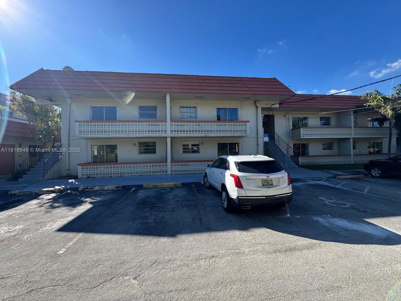 1825 Southwest 67th Avenue, Unit 24 West Miami, FL 33155 - Photo 11 of 11 a car parked in front of a building