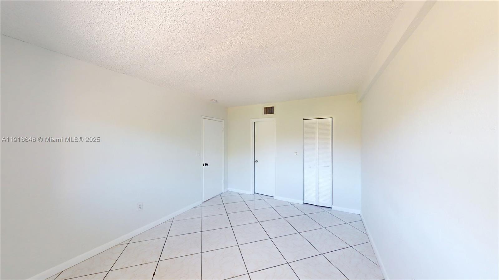 1825 Southwest 67th Avenue, Unit 24 West Miami, FL 33155 - Photo 5 of 11 a view of an empty room