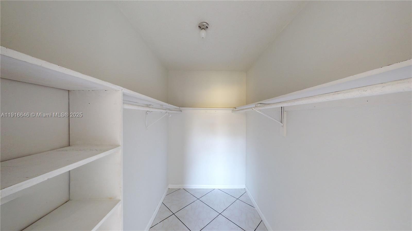 1825 Southwest 67th Avenue, Unit 24 West Miami, FL 33155 - Photo 6 of 11 a view of an empty walk in closet