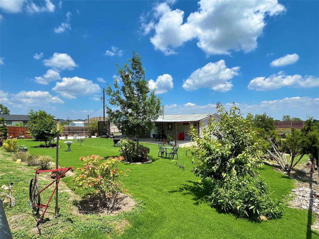 119 Overlook Trail Azle, TX 76020 - Photo 3 of 20 a view of a flower garden with a house
