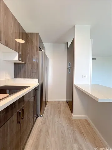 a kitchen with granite countertop a sink and a stove