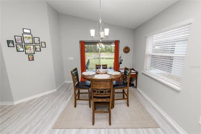 a dining room with furniture and window